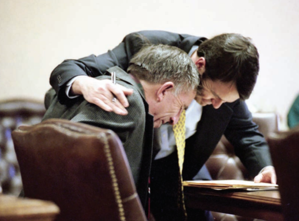 Alvin being comforted by McCracken after verdict.