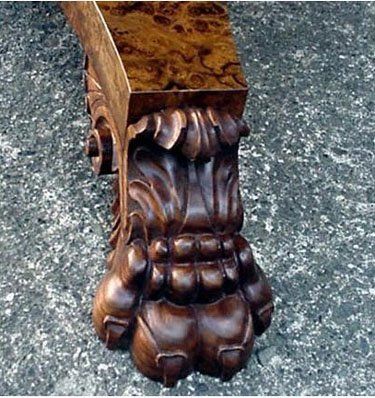 Carved walnut foot and burl veneer