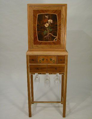 Cherry wine cabinet with marquetry door and drawer panel