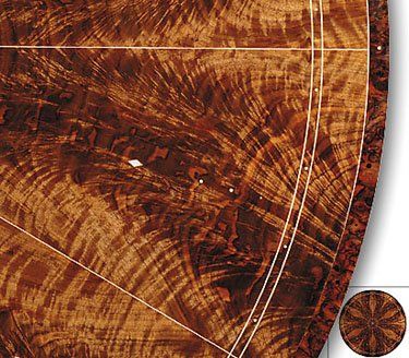 Detail of walnut crotch and burl, holly inlay, buffalo horn, and Okinawan sea snail.