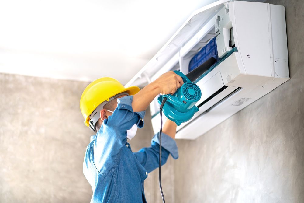 cleaning and maintenance Air conditioner on the wall with blower