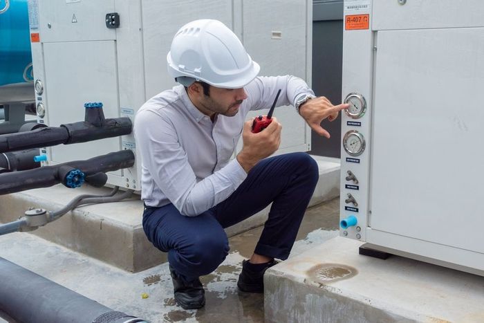 engineer under checking the industry chilled water fan