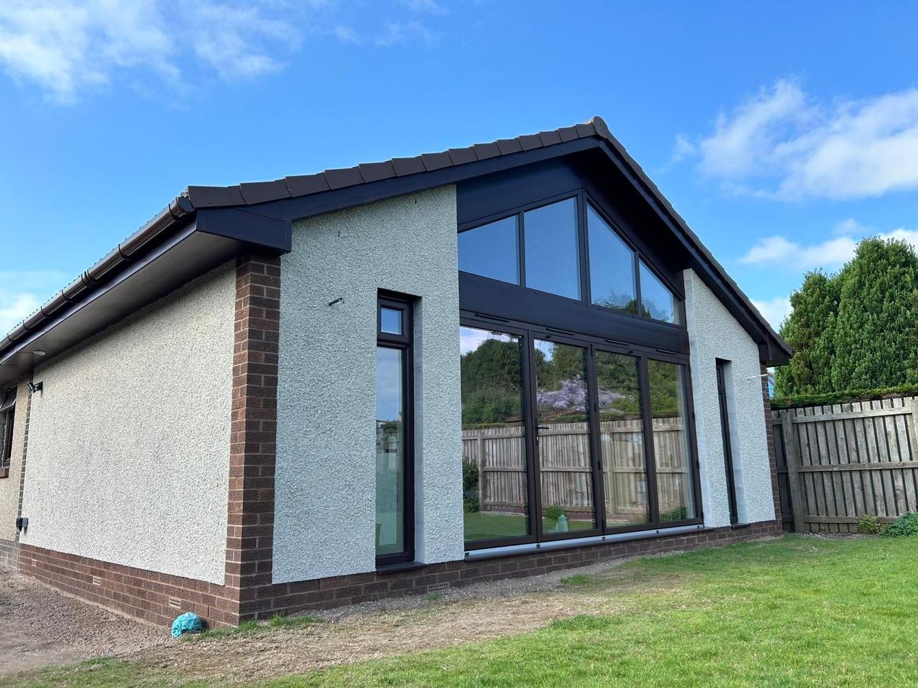 Highly glazed gable extension with bi-fold doors in Fife