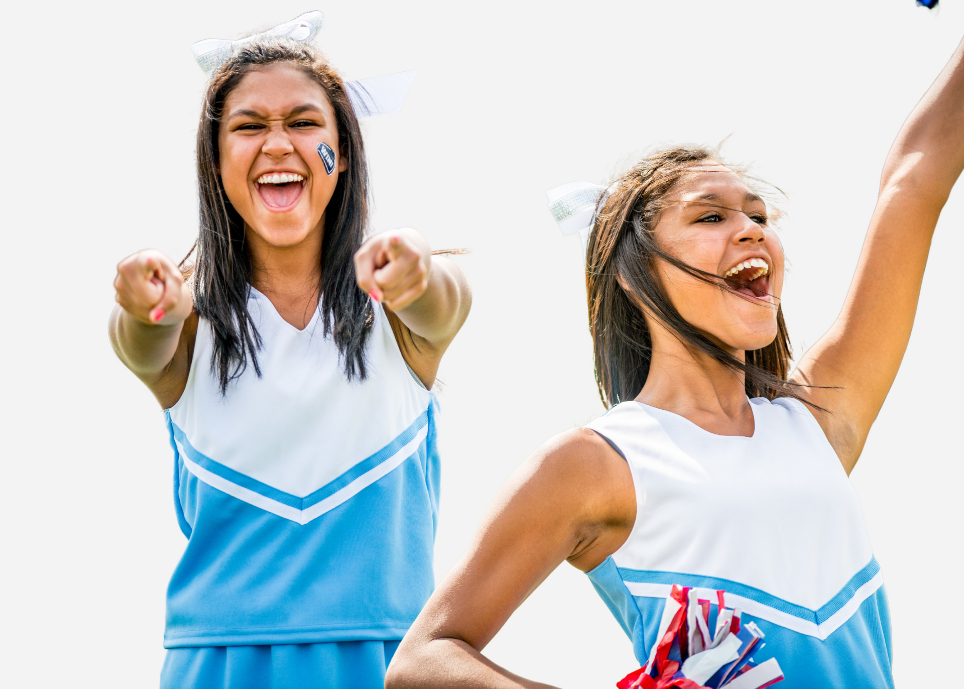 Two cheerleaders are standing next to each other on a field.