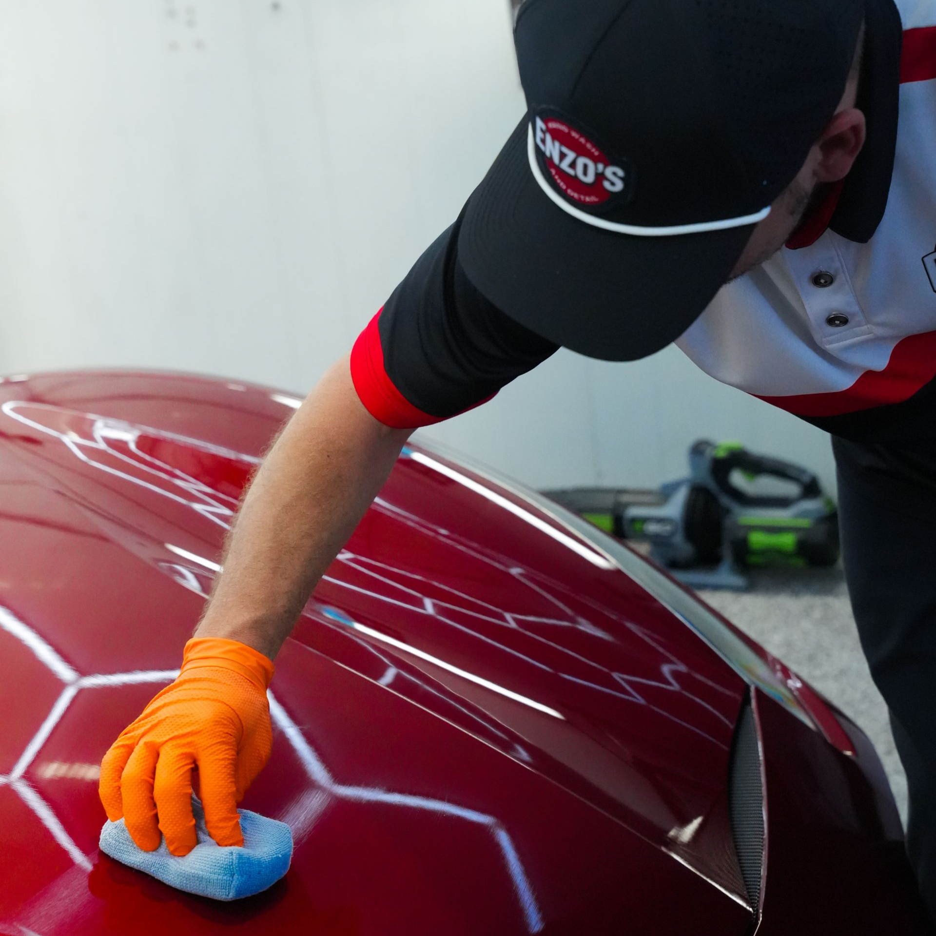 A man is holding a piece of glass with a picture of a cat on it