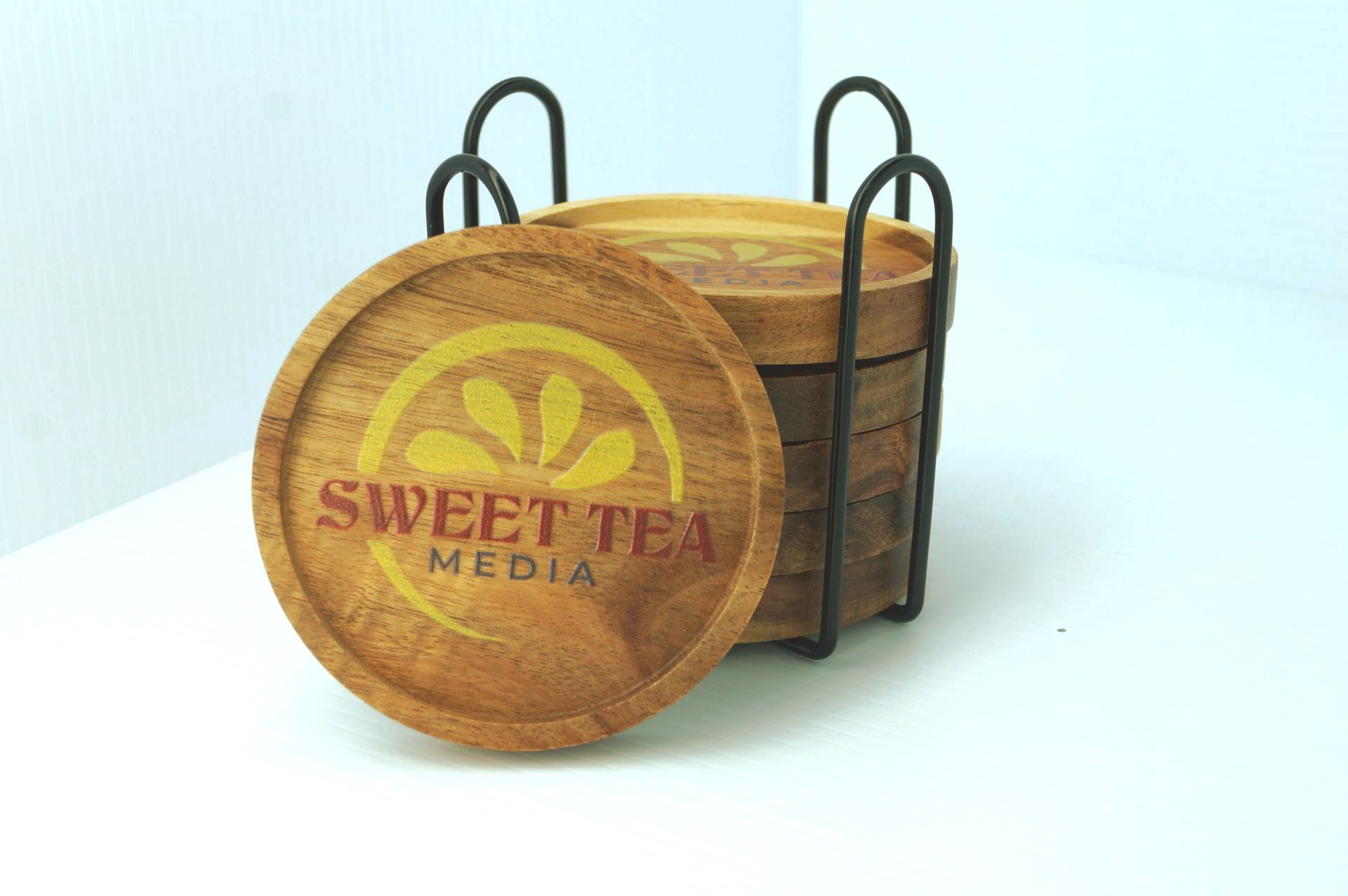 A set of wooden coasters that say sweet tea media