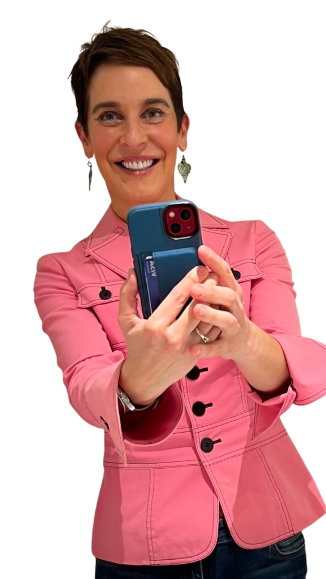 A woman in a pink jacket is taking a selfie with her cell phone.