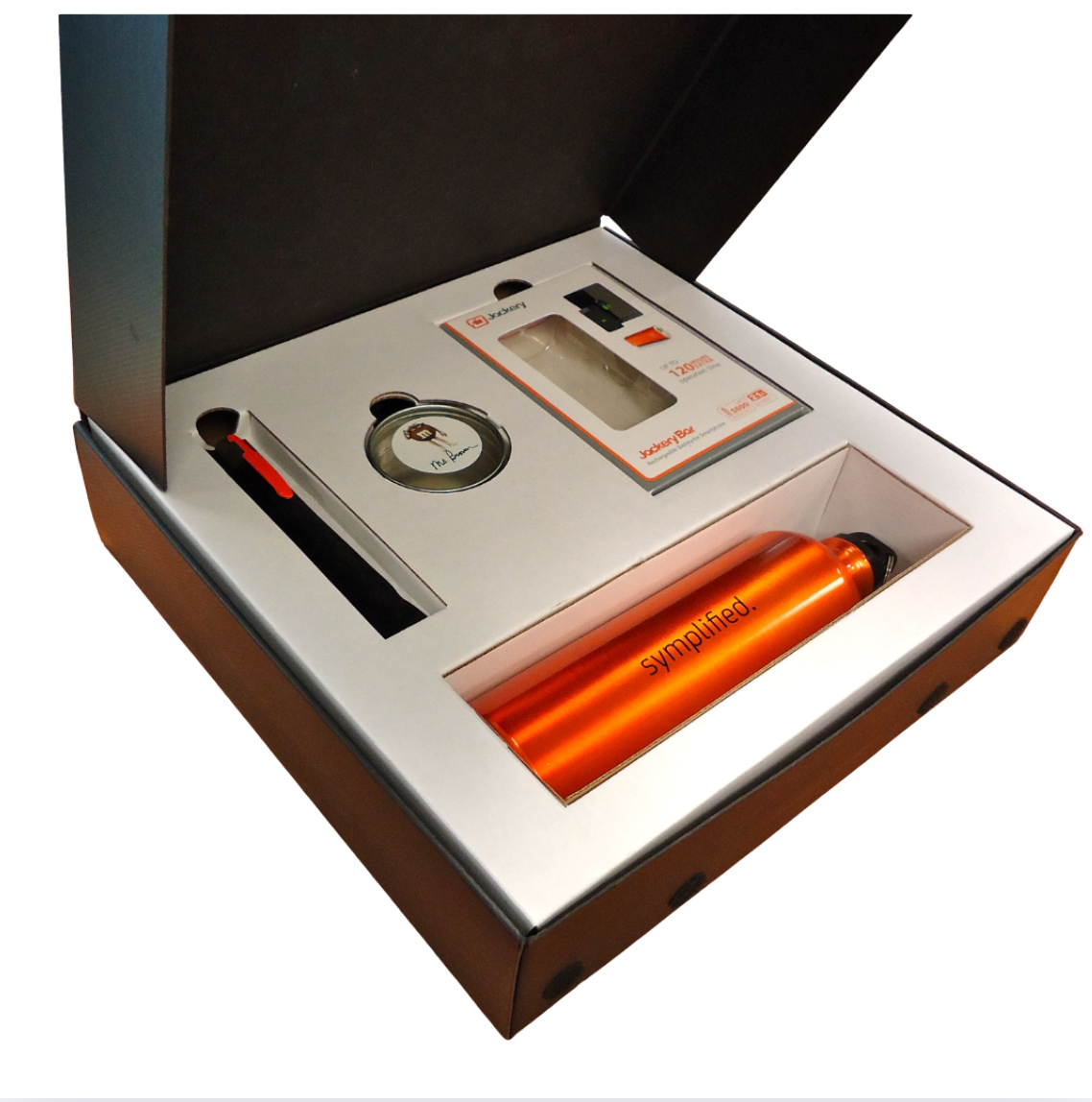 A box with a bottle and a pen in it