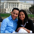 A man and a woman are posing for a picture in front of the capitol building.