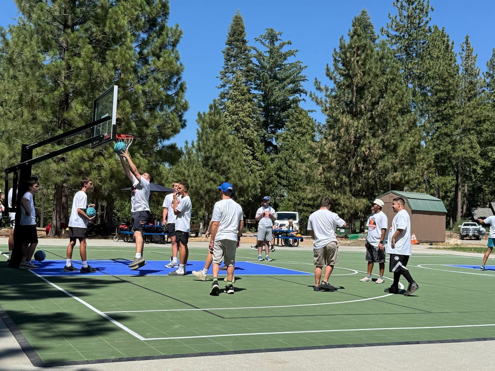 Two people are riding a buggy in a parking lot.
