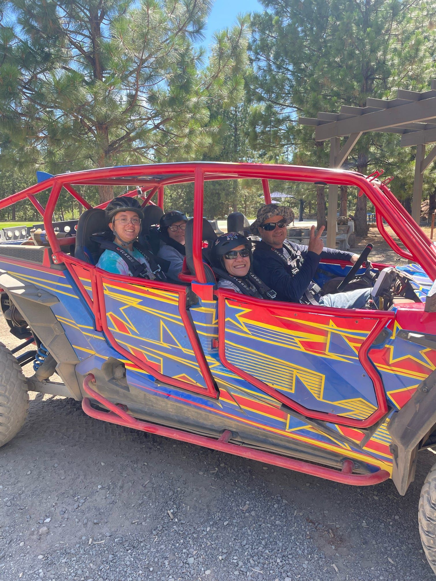 A group of people are playing with water in a field.