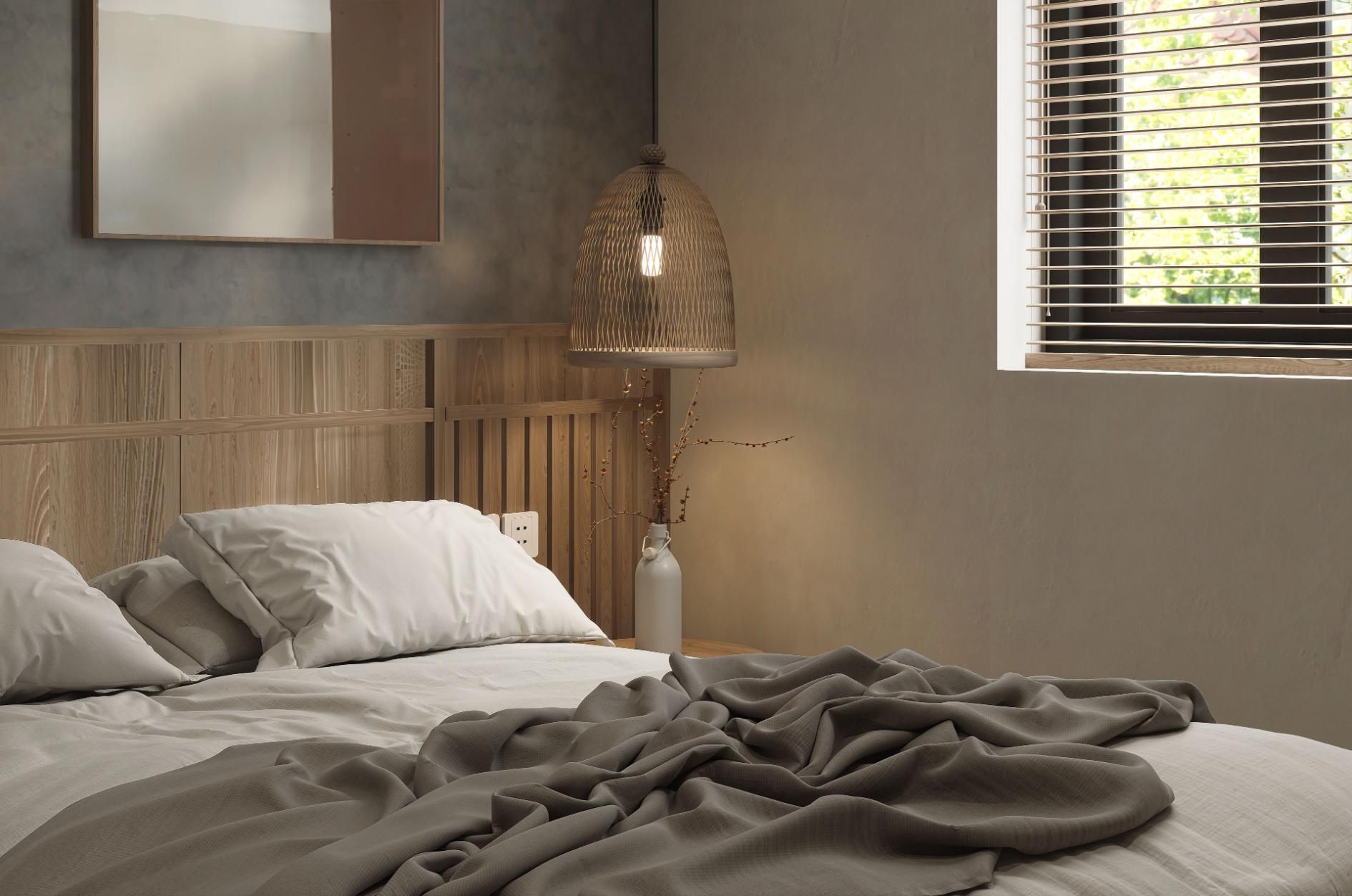 Cozy bedroom with a wooden bed, rumpled gray bedding, woven lamp, and window blinds.