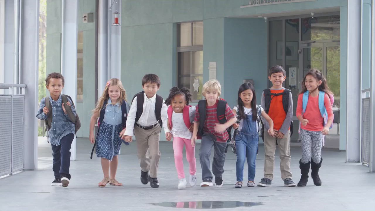 Kids running in a school corridor
