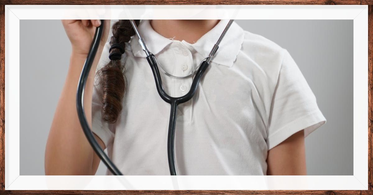 Child wearing a doctor's stethoscope