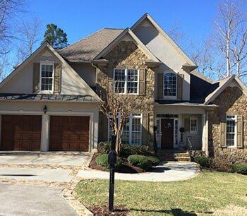 White House with Stone Textured Wall — Construction contractors in Cleveland, TN