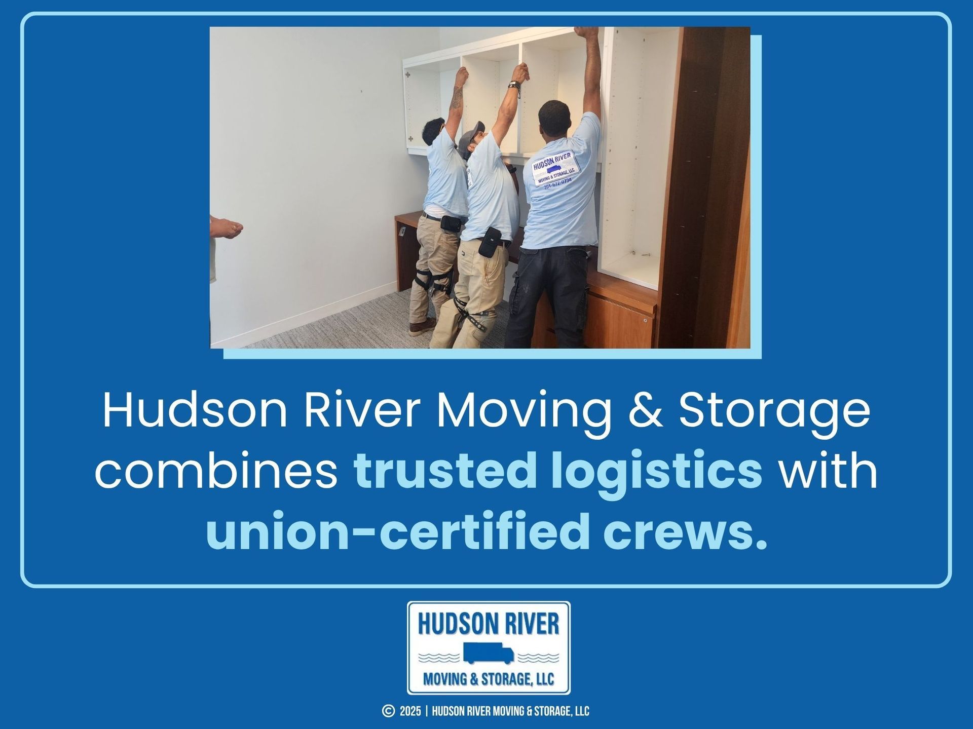 Three workers are installing a large white shelving unit in an office.