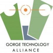 The logo for the gorge technology alliance is green and blue.