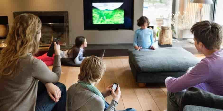 Family watching TV creating airborne noise