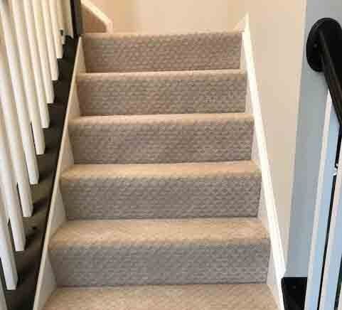 Carpet on stairs after laying soundproofing mats