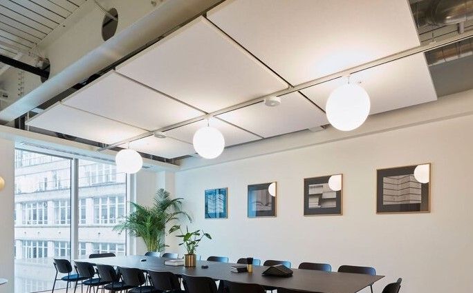 Acoustic ceiling rafts in a boardroom