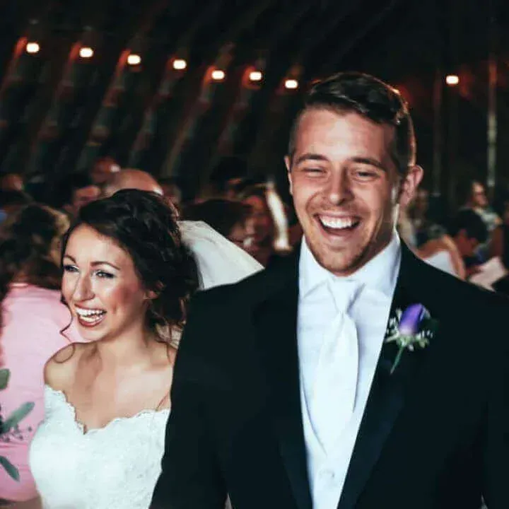 Bride and groom smiling and walking