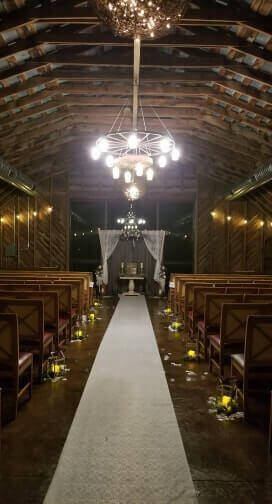 Wedding ceremony setup in rustic barn