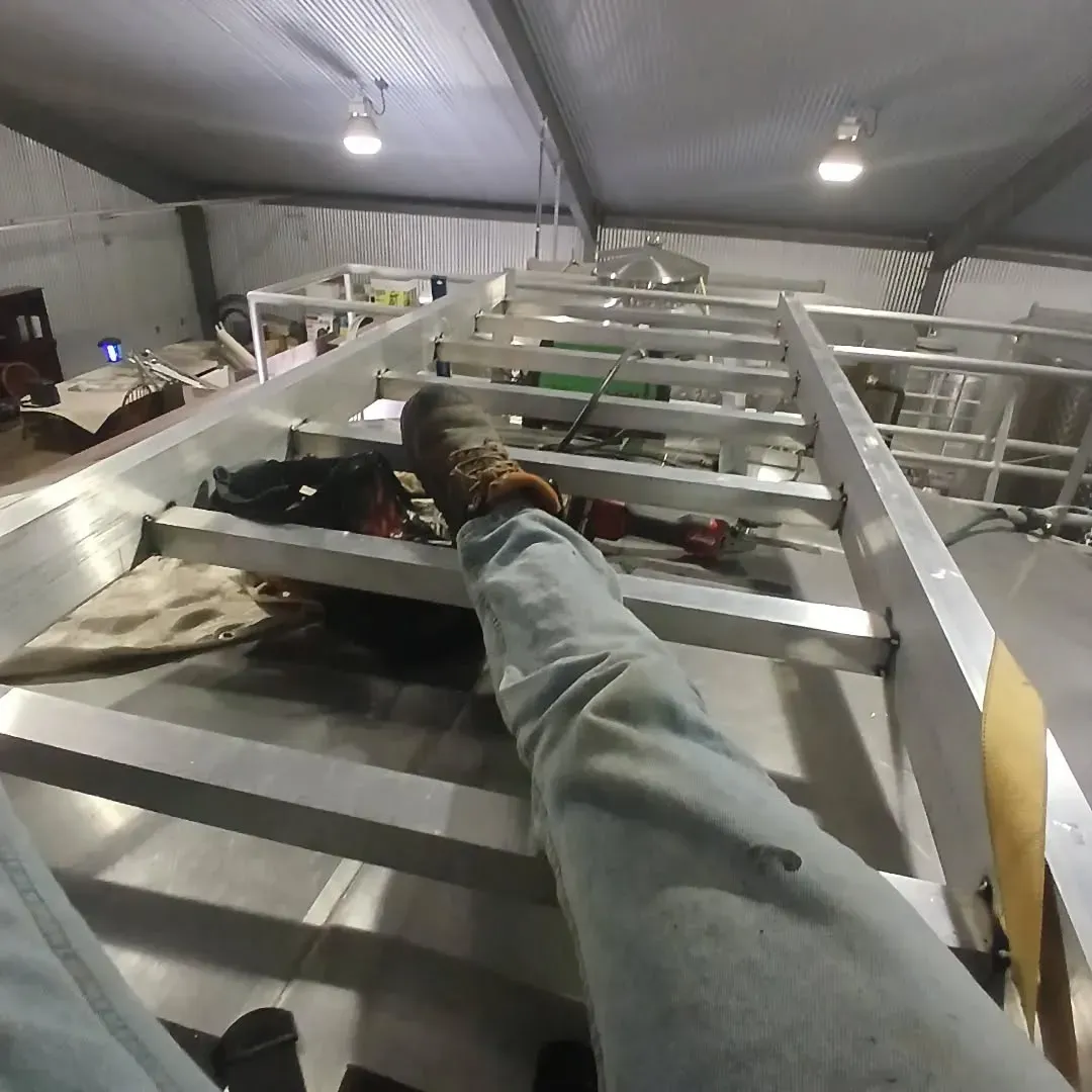 A person laying on a ladder with their feet up