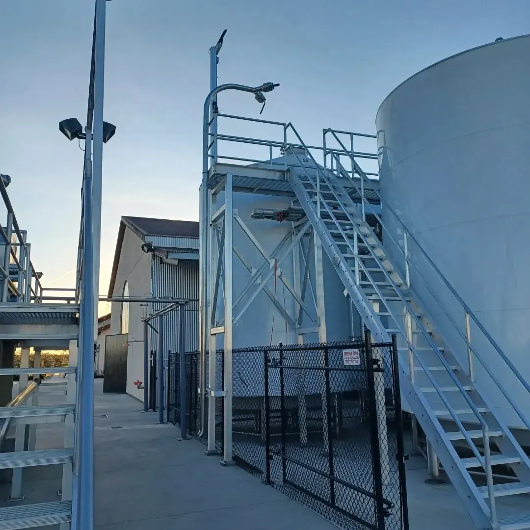 A building with stairs leading up to it and a fence around it