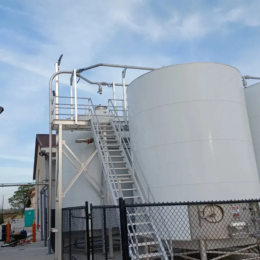 A large white tank with stairs leading up to it