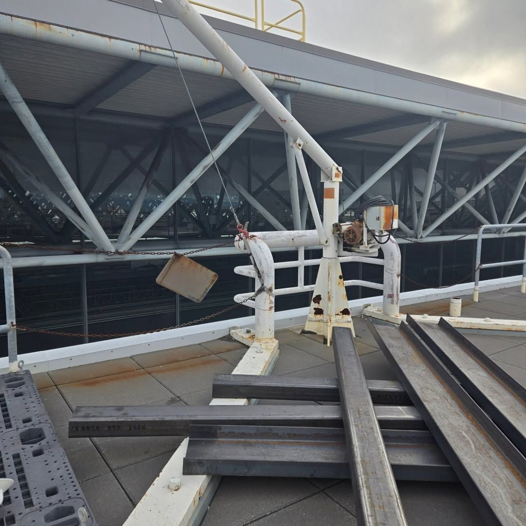 A large metal structure with a crane attached to it