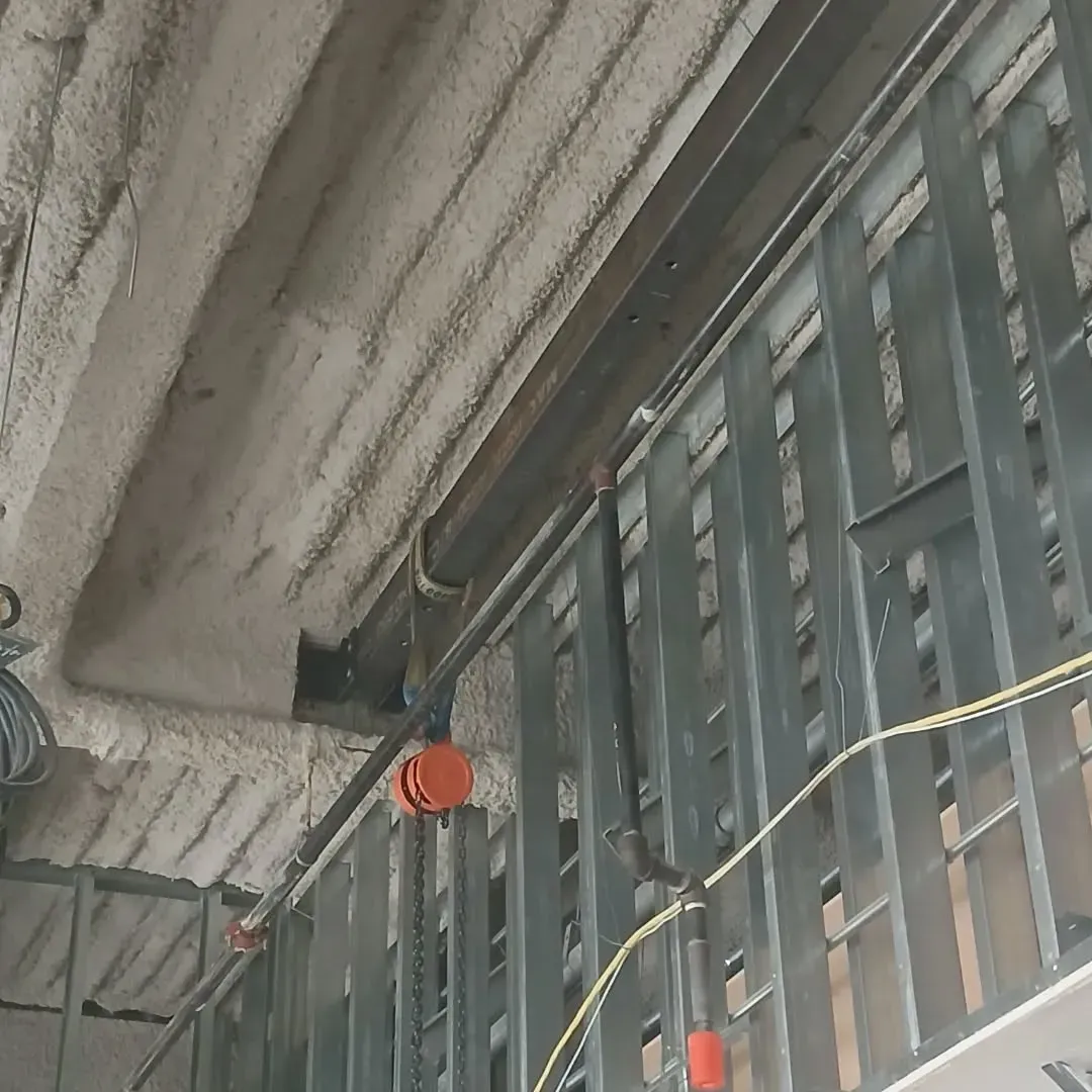 A ceiling with a lot of wires hanging from it
