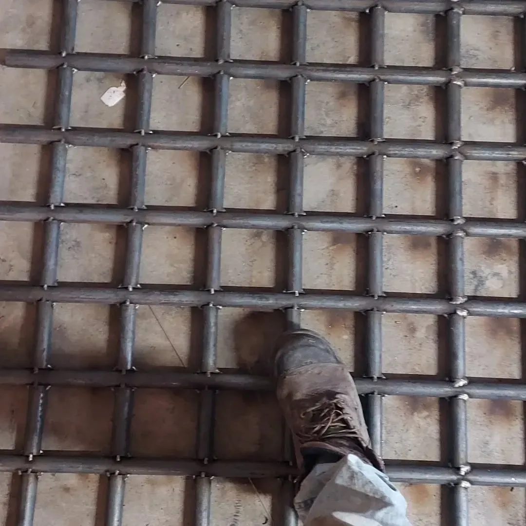 A close up of a metal structure with stairs and pipes