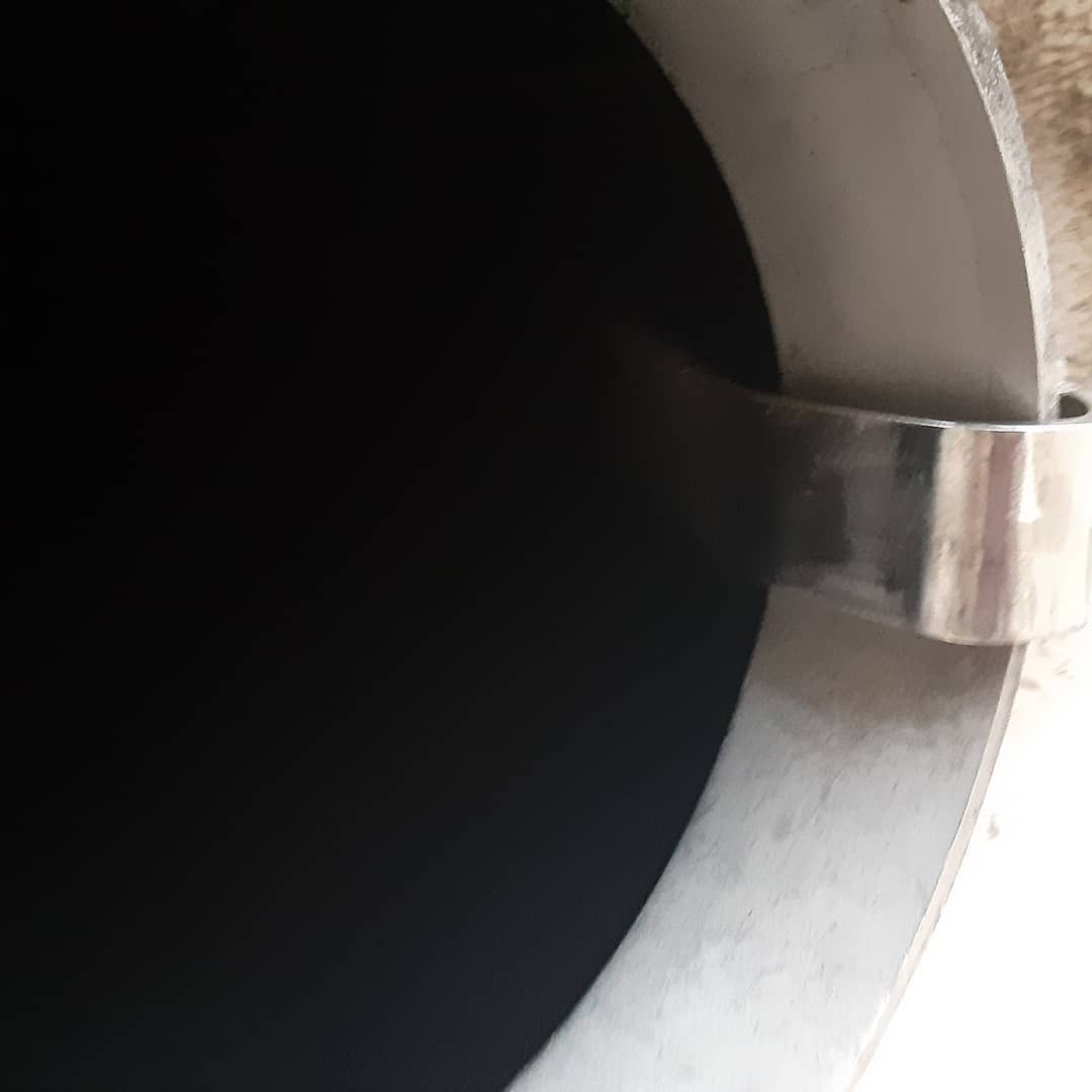 A close up of a metal pipe with a ring on it.