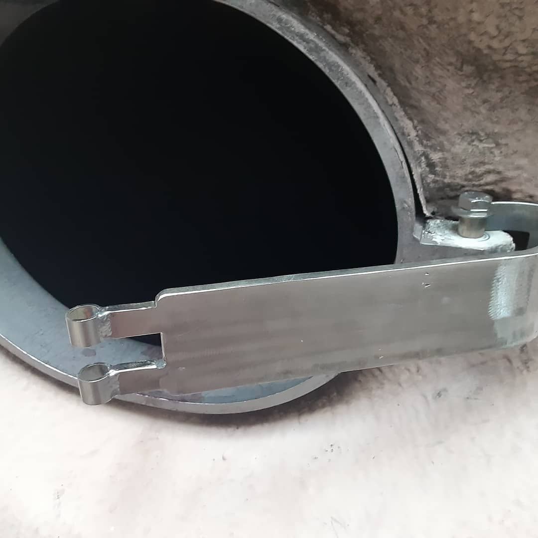 A close up of a metal pipe with a handle on it.