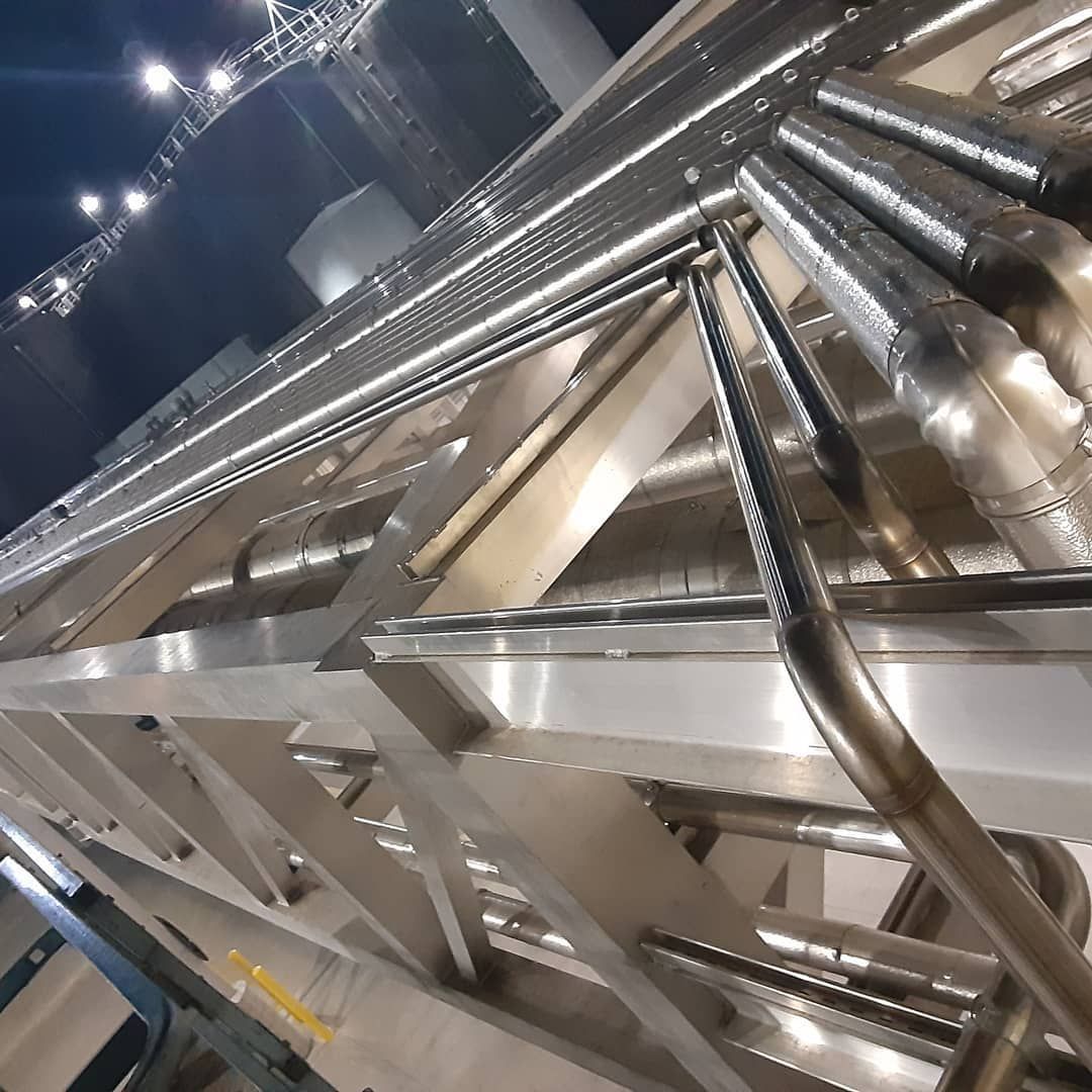 Looking up at a metal structure at night