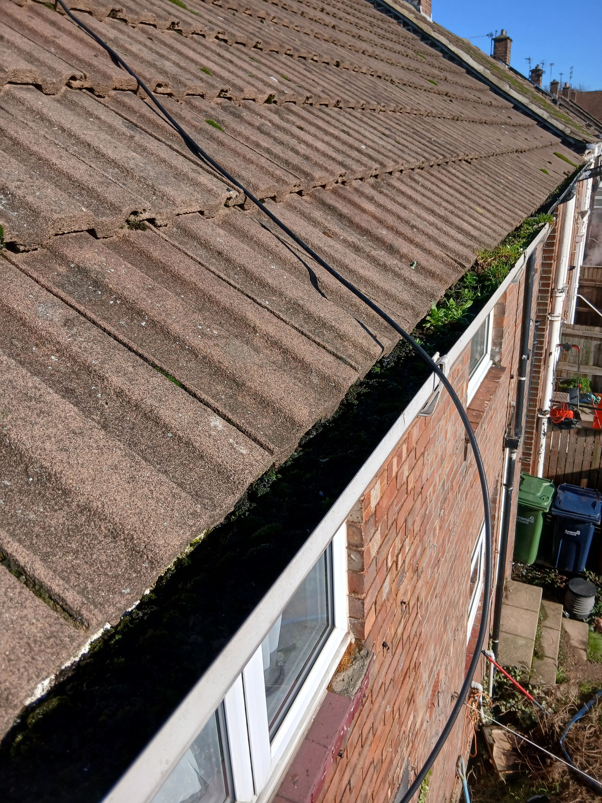 Blocked gutter before being cleared