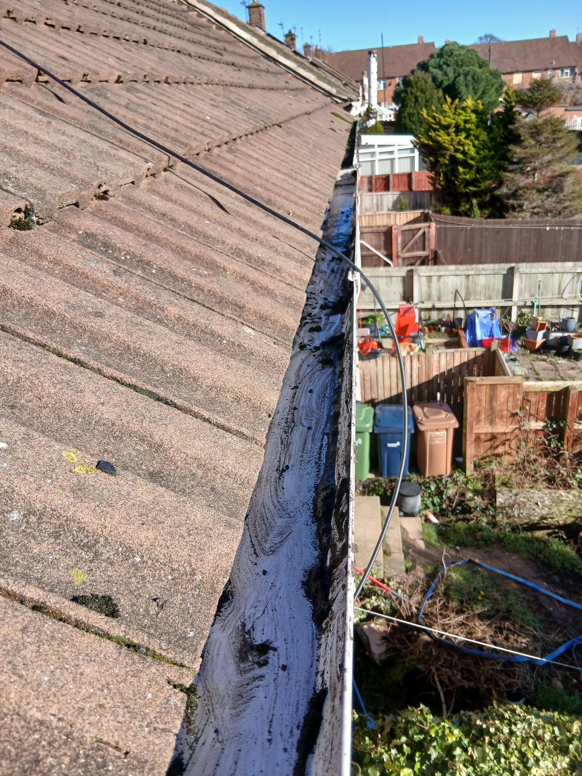 A gutter after it has been cleared.