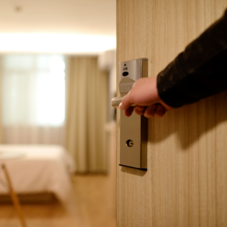 hotel worker opening door