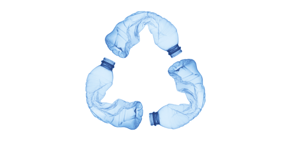 A recycling symbol made out of plastic bottles on a white background.