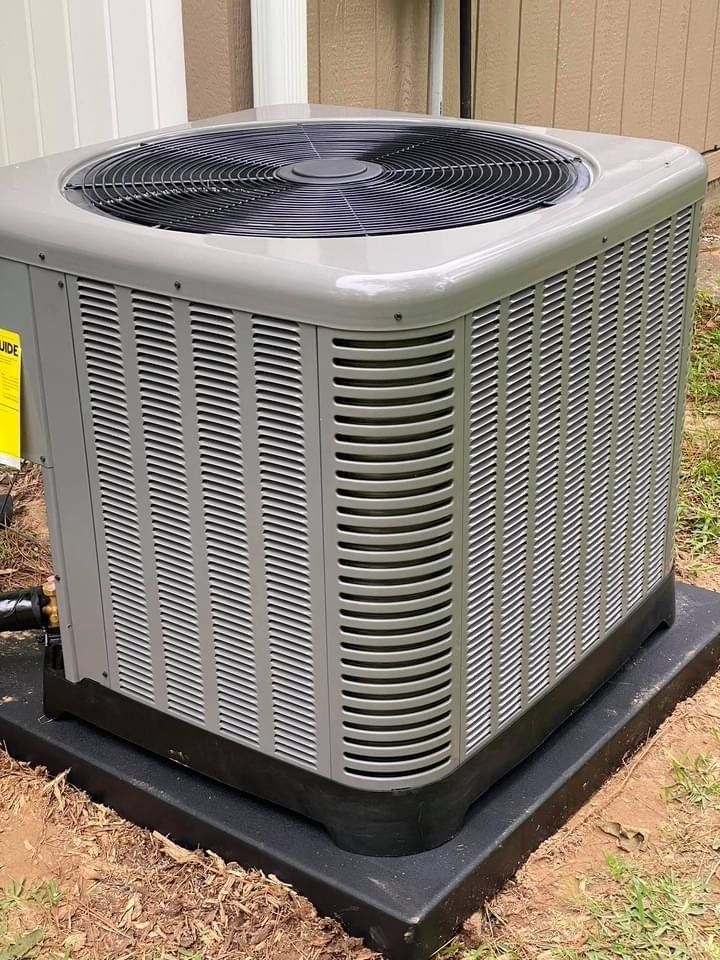 Man Checking Aircon ─ Stonewall, LA ─ B & B AC Service & Repair