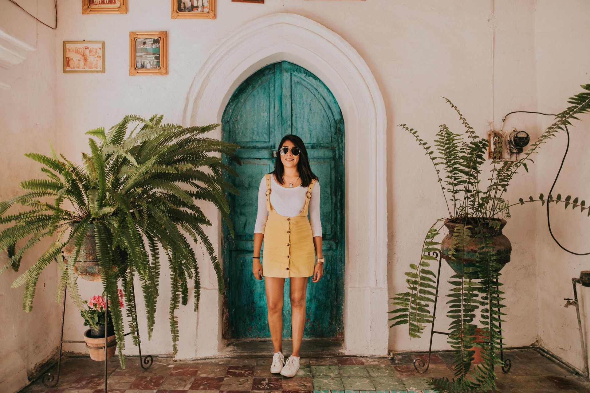 girl at colorful charleston front door for design