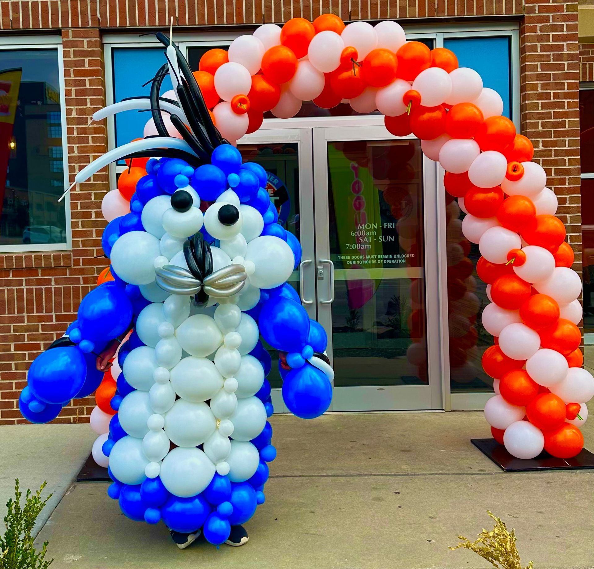 A blue and white bunny made out of balloons
