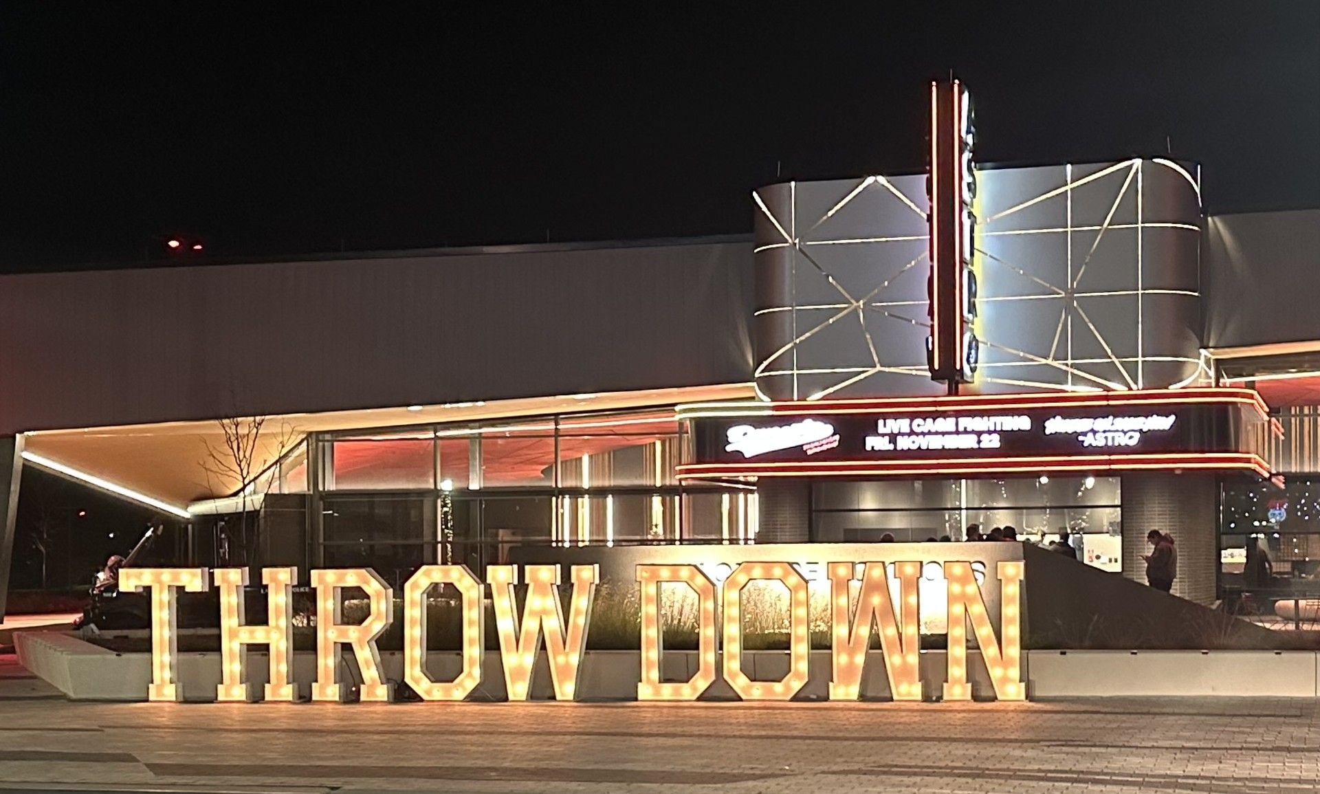 A large sign that says throw down in front of a building