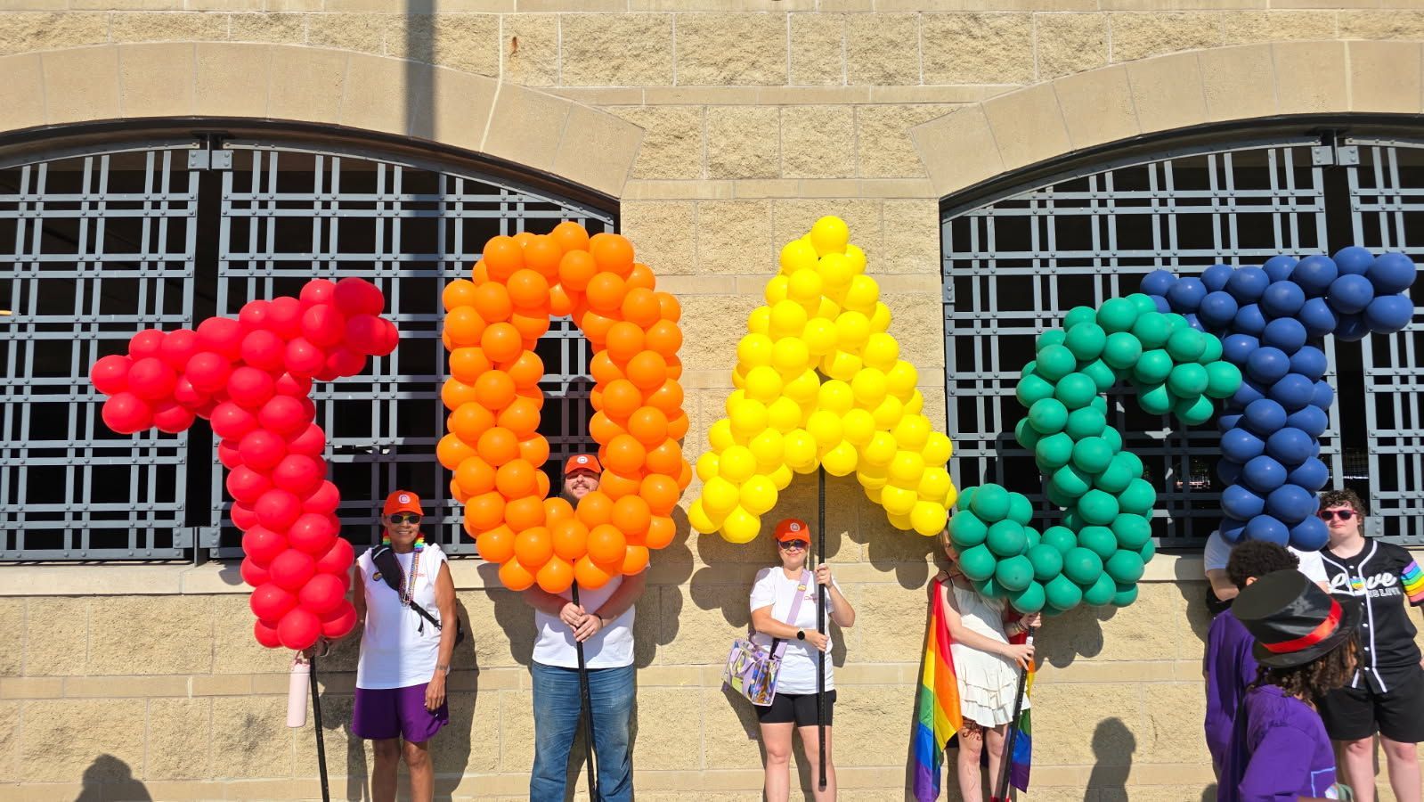 Parade Pole balloon letters for Toast for the Omaha Pride Parade.