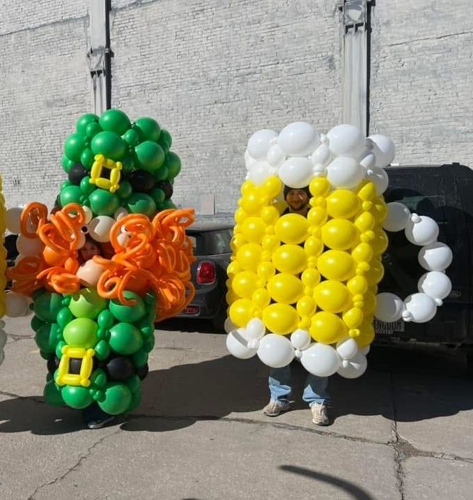 A leprechaun and a beer mug made out of balloons