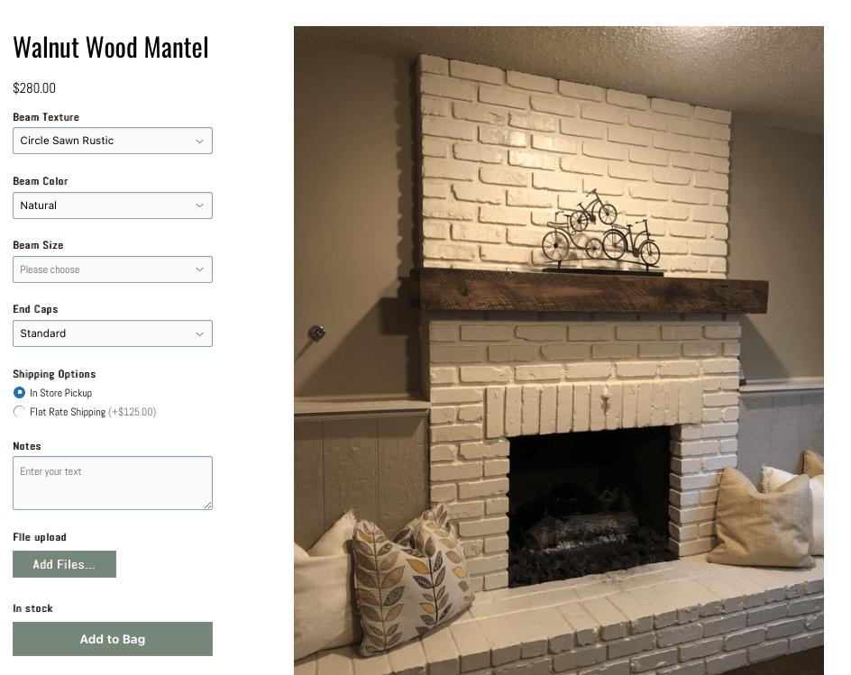 A white brick fireplace with a wooden mantle in a living room.