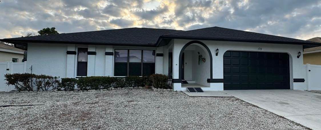 A house with a roof that has a gutter on it
