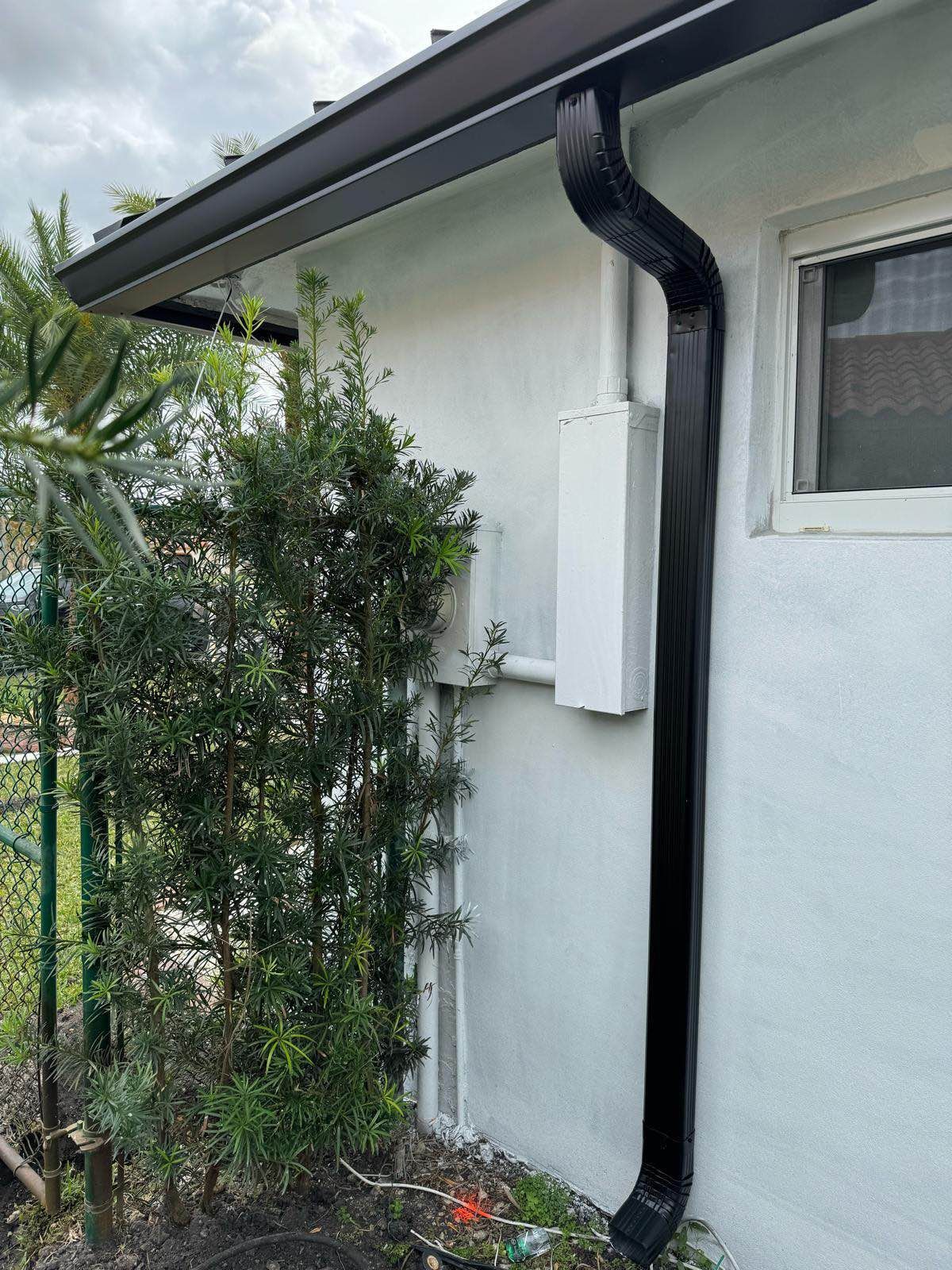 A ladder is leaning against the side of a house.