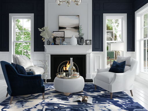 A living room with blue walls , white chairs , a fireplace and a rug.