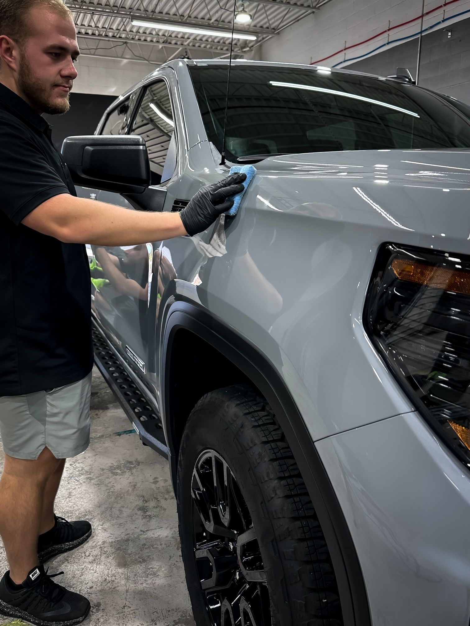 Applying ceramic coating on the SUV.